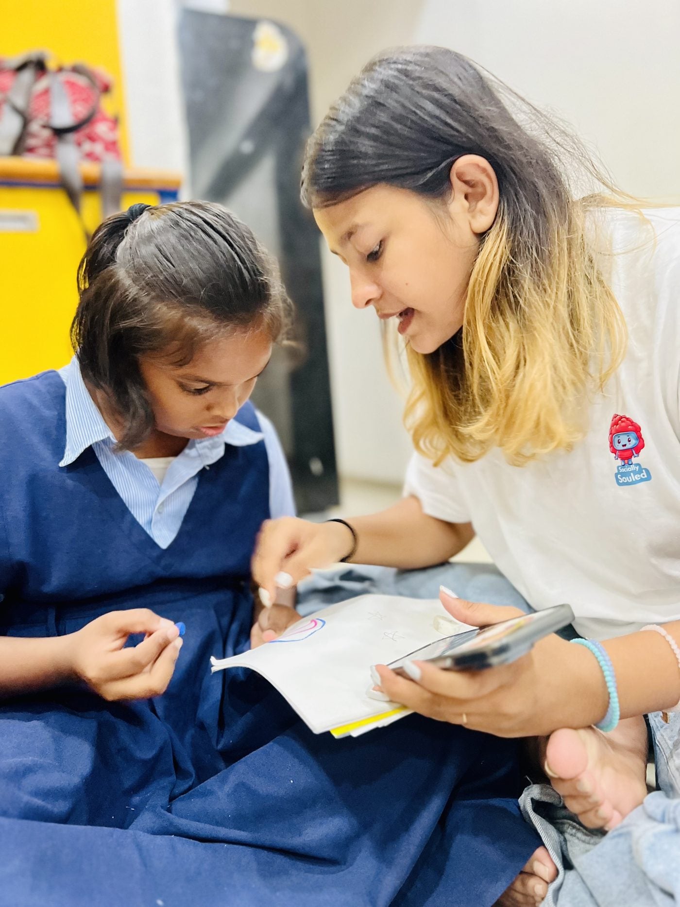 A mentor working with a school student