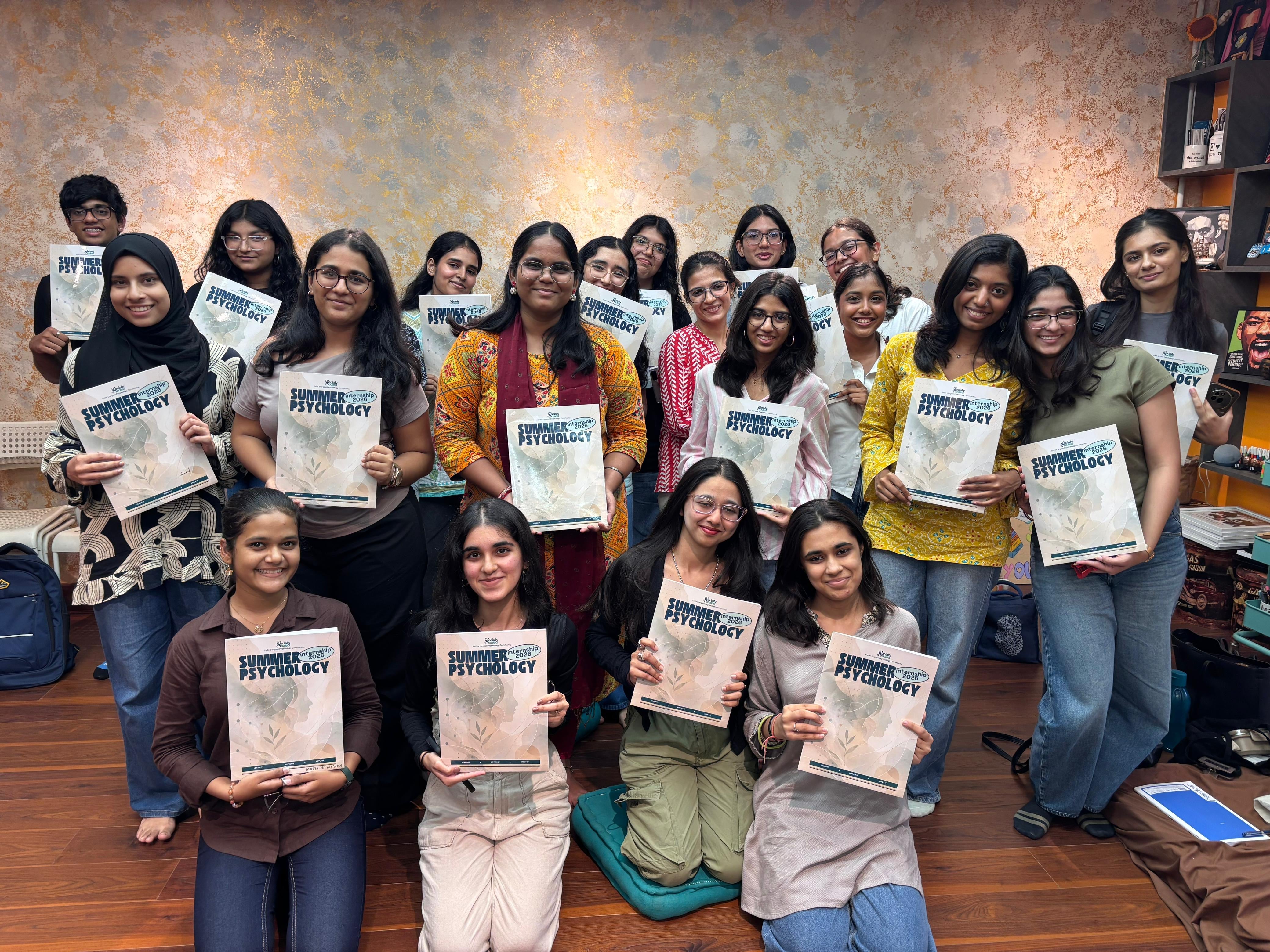 The Summer Internship cohort with their workbooks